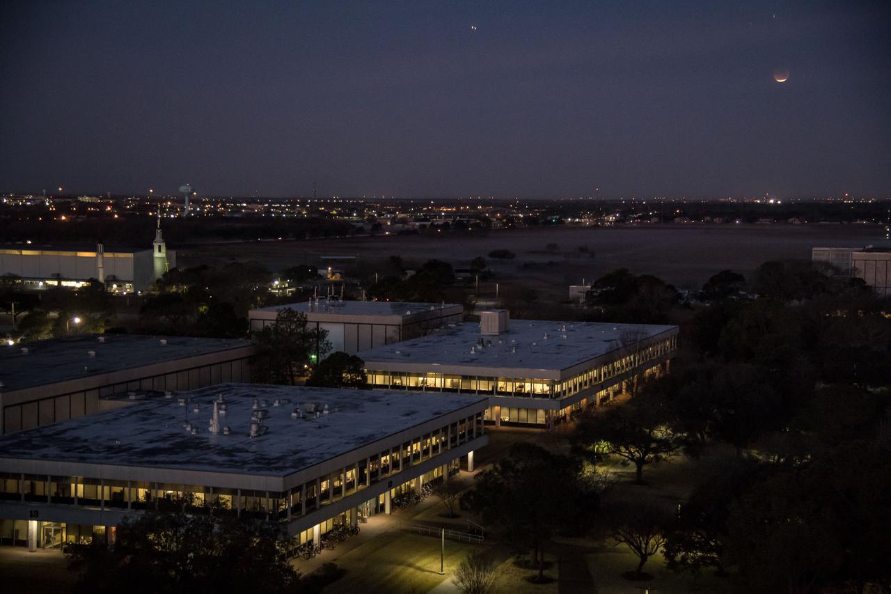 jsc2018e003201 (Jan. 31, 2018) --- The lunar eclipse "Blood Moon" was photographed from the Johnson Space Center in Houston, Texas, during sunrise on Jan. 31, 2018. Credit: NASA/Robert Markowitz