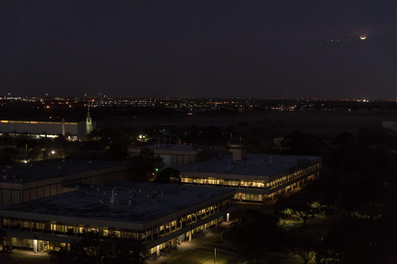 jsc2018e003256 (Jan. 31, 2018) --- The lunar eclipse "Blood Moon" was photographed from the Johnson Space Center in Houston, Texas, during an early sunrise on Jan. 31, 2018. Credit: NASA/Robert Markowitz