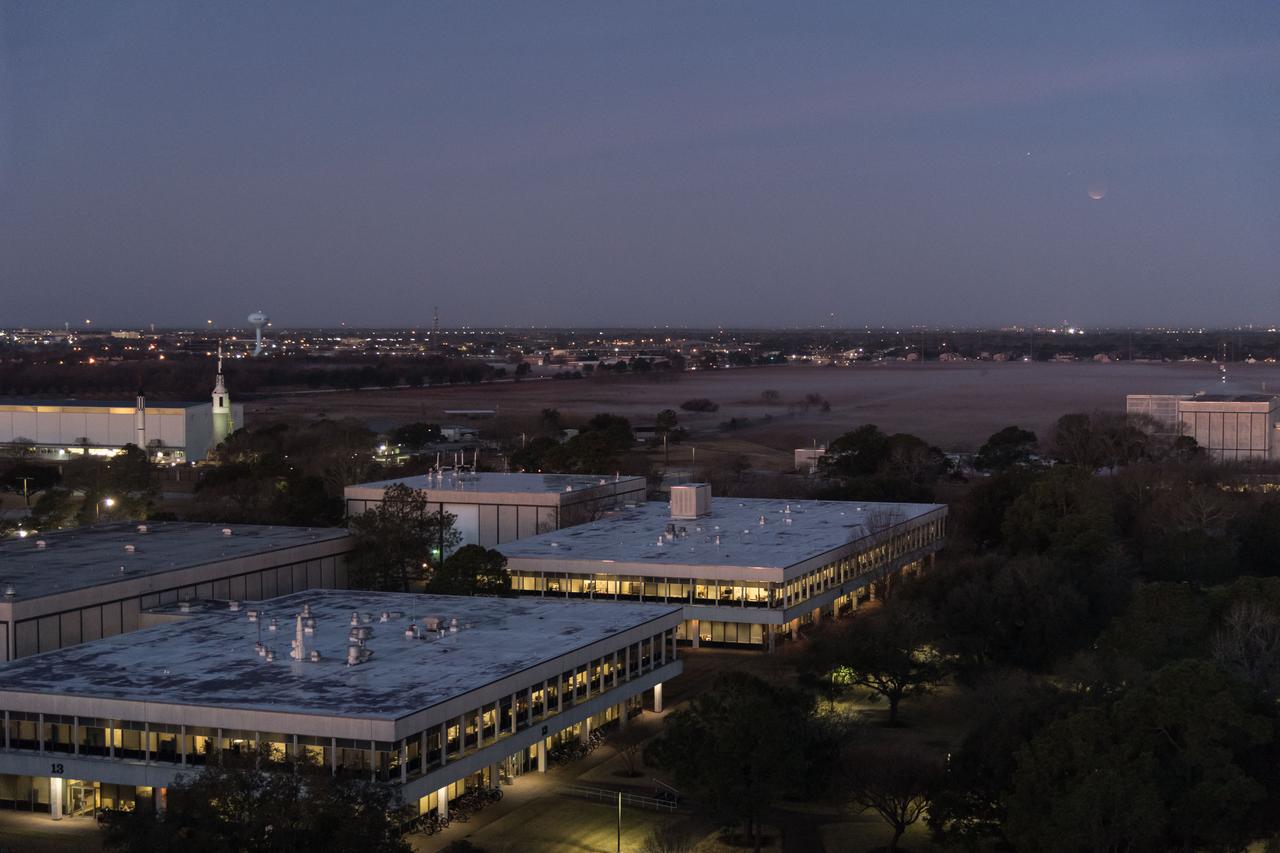 jsc2018e003257 (Jan. 31, 2018) ---  The lunar eclipse "Blood Moon" was photographed from the Johnson Space Center in Houston, Texas during sunrise on Jan. 31, 2018. Credit: NASA/Robert Markowitz