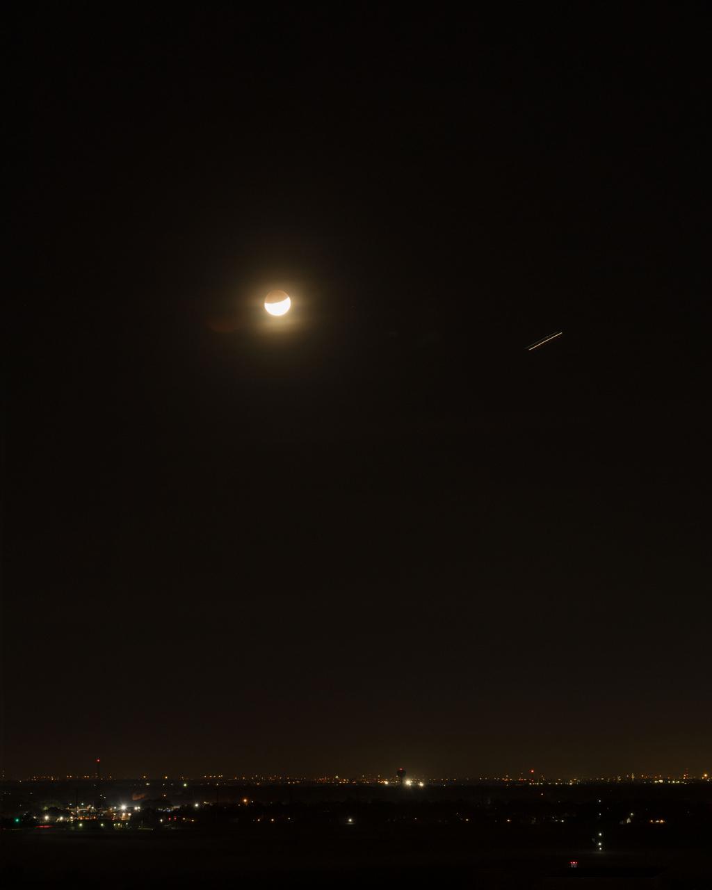 jsc2018e003258 (Jan. 31, 2018) --- The lunar eclipse "Blood Moon" was photographed from the Johnson Space Center in Houston, Texas, during the early morning hours of Jan. 31, 2018. Credit: NASA/ Norah Moran