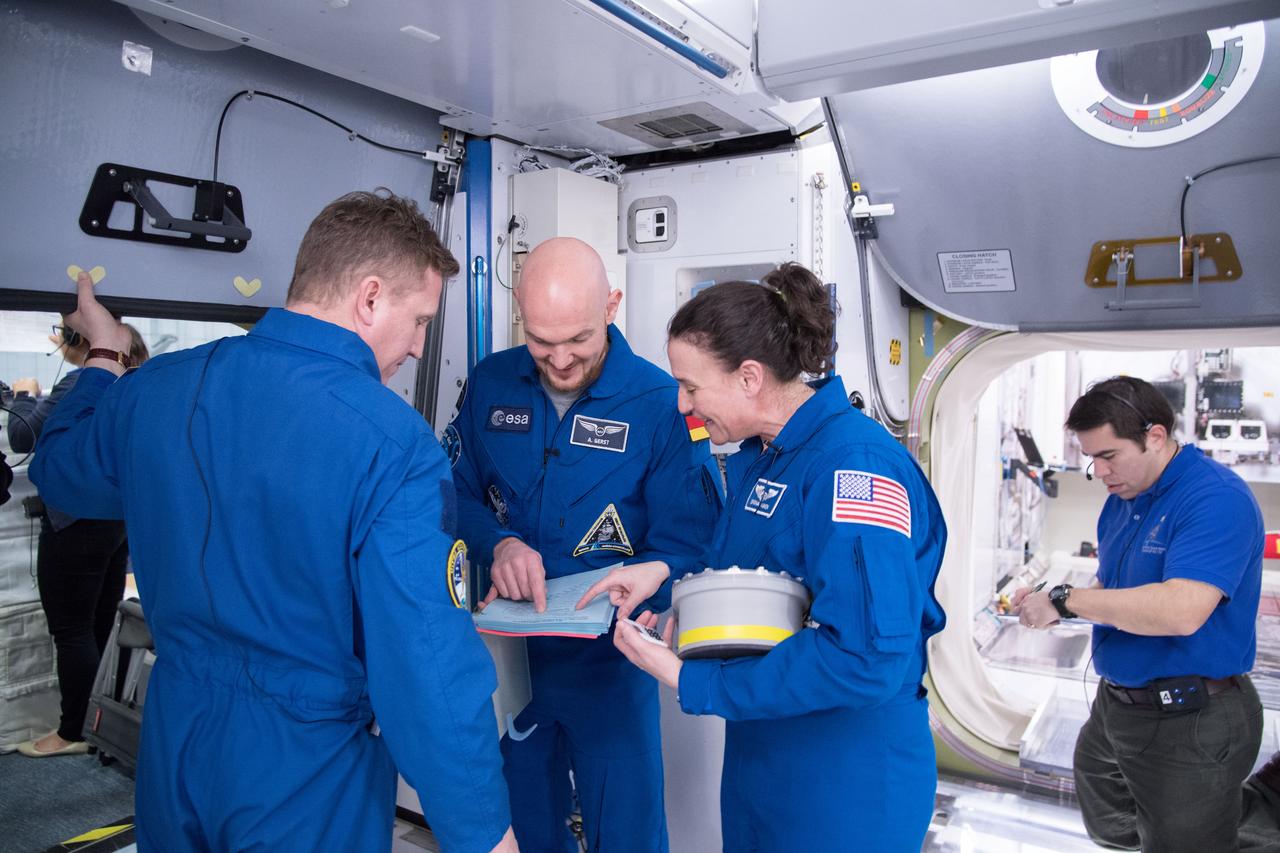 jsc2018e005507 (February 9, 2018) --- Expedition 56-57 crew members (from left) Sergei Propokev of Roscosmos, Alexander Gerst of the European Space Agency and Serena Auñón-Chancellor of NASA train for their mission inside a space station simulator at the Johnson Space Center.