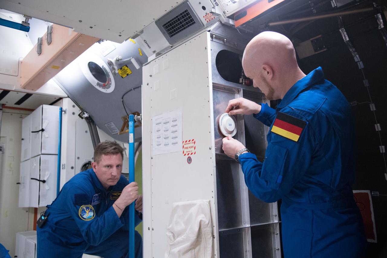 jsc2018e005523 (February 9, 2018) --- Expedition 56-57 crew members (from left) Sergei Propokev of Roscosmos and Alexander Gerst of the European Space Agency train for their mission inside a space station simulator at the Johnson Space Center.