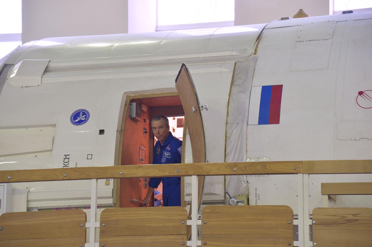 At the Gagarin Cosmonaut Training Center in Star City, Russia, Expedition 55 prime crewmember Drew Feustel of NASA peers out of a Russian module training mockup during a day of qualification exams Feb. 20. Feustel, Ricky Arnold of NASA and Oleg Artemyev of Roscosmos will launch March 21 on the Soyuz MS-08 spacecraft from the Baikonur Cosmodrome in Kazakhstan for a five month mission on the International Space Station.  NASA/Elizabeth Weissinger
