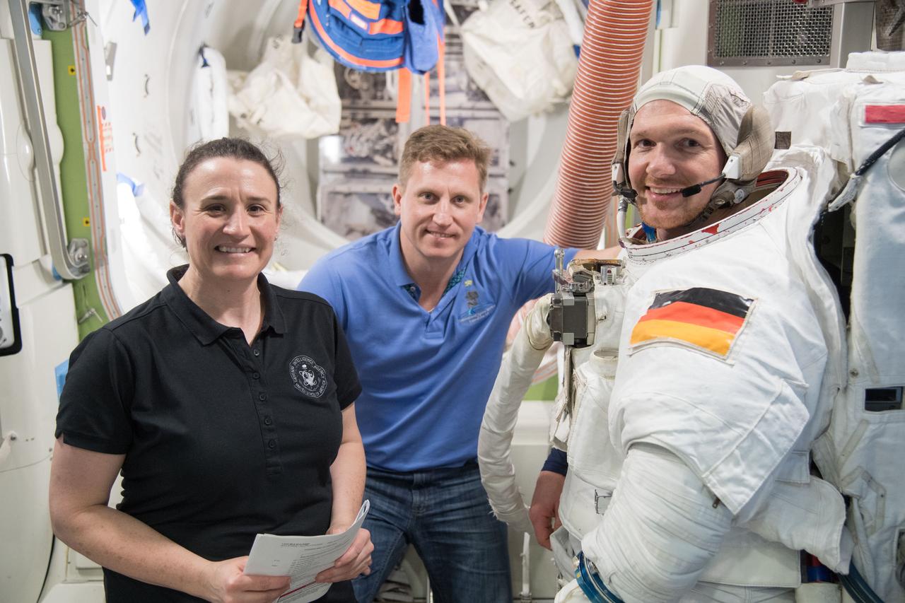 jsc2018e007629 (February 15, 2018) --- Expedition 56-57 crew members (from left) Serena Auñón-Chancellor of NASA, Sergei Propokev of Roscosmos and Alexander Gerst of the European Space Agency work inside the Space Station Airlock Test Article to train for the procedures necessary to prepare for a spacewalk.
