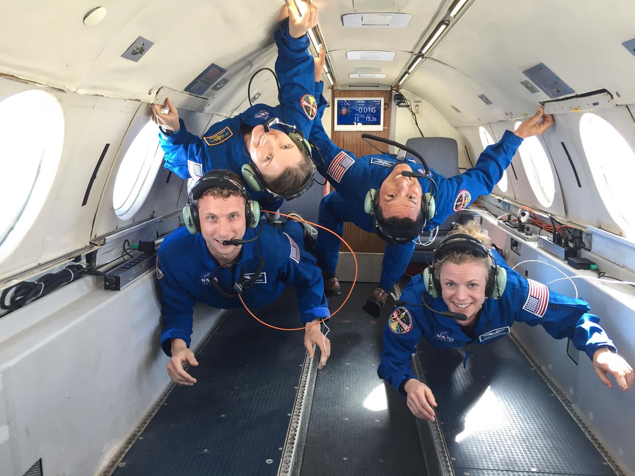 jsc2018e009222 (February 21, 2018) --- (From left) 2017 NASA astronaut candidates Warren Hoburg, Kayla Barron, Frank Rubio, and Zena Cardman take hold to their surroundings during their reduced gravity flight aboard Canadian Space Agency’s Dassault Falcon 20 Jet. Photo Credit: (NASA/Robert Markowitz)