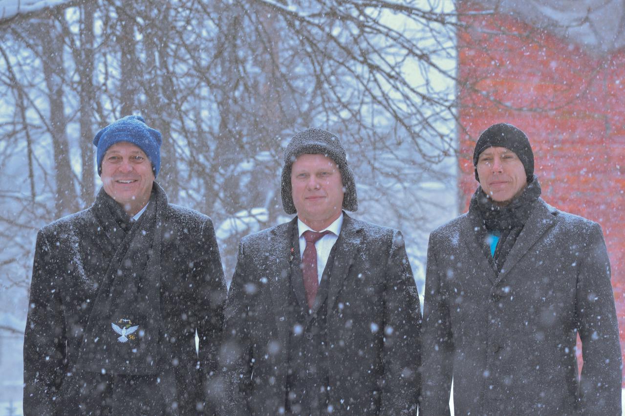 jsc2018e010822 - Bundled up against a blizzard, Expedition 55 crewmembers Ricky Arnold of NASA (left), Oleg Artemyev of Roscosmos (center) and Drew Feustel of NASA (right) pose for pictures March 4 at the Gagarin Cosmonaut Training Center in Star City, Russia before flying to their launch site at the Baikonur Cosmodrome in Kazakhstan. The trio will launch March 21 on the Soyuz MS-08 spacecraft for a five month mission on the International Space Station...NASA/Elizabeth Weissinger.