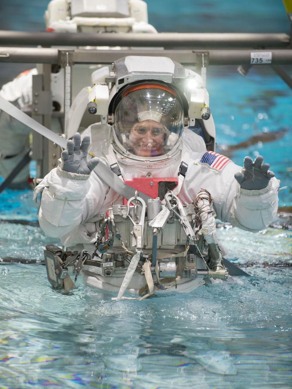 jsc2018e010861 (March 5, 2018) --- Expedition 56-57 crew member Serena Auñón-Chancellor of NASA is suited up and lowered into the Neutral Buoyancy Laboratory for spacewalk training in Houston, Texas.
