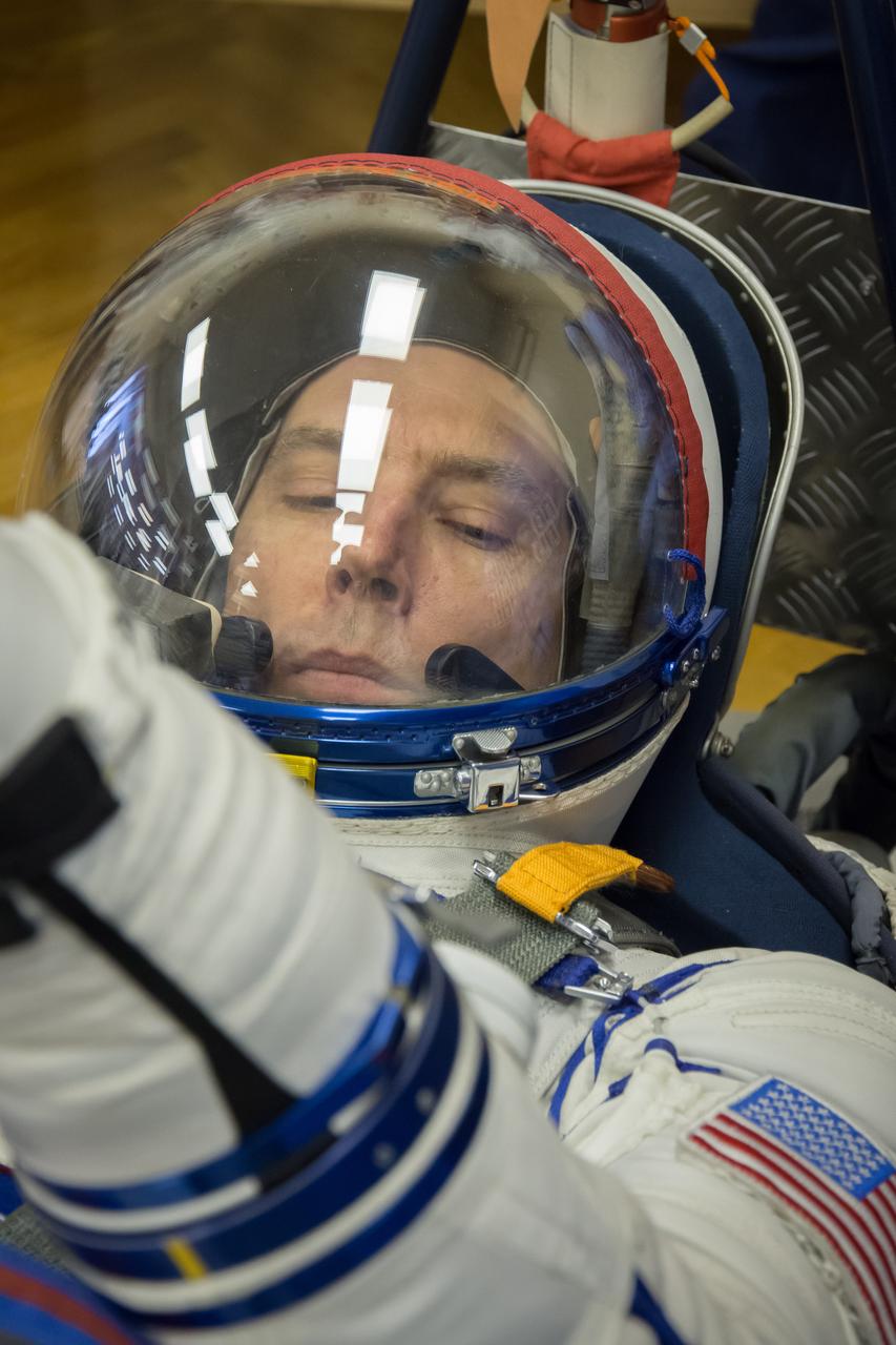 jsc2018e010868 - At the Baikonur Cosmodrome in Kazakhstan, Expedition 55 crewmember Drew Feustel of NASA undergoes a leak check March 5 in a Russian Sokol launch and entry suit as part of the crew’s first vehicle fit check activities. Feustel, Ricky Arnold of NASA and Oleg Artemyev of Roscosmos will launch March 21 in the Soyuz MS-08 spacecraft from Baikonur for a five-month mission on the International Space Station...NASA/Victor Zelentsov.