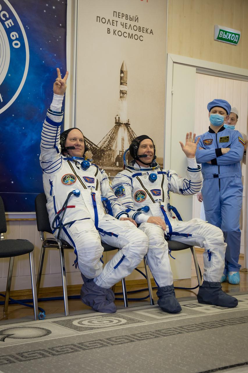 jsc2018e010870 - At the Baikonur Cosmodrome in Kazakhstan, Expedition 55 crewmembers Oleg Artemyev of Roscosmos (left) and Drew Feustel of NASA (right) wave to photographers March 5 during the crew’s first vehicle fit check activities. Along with Ricky Arnold of NASA, they will launch March 21 in the Soyuz MS-08 spacecraft from Baikonur for a five-month mission on the International Space Station...NASA/Victor Zelentsov.