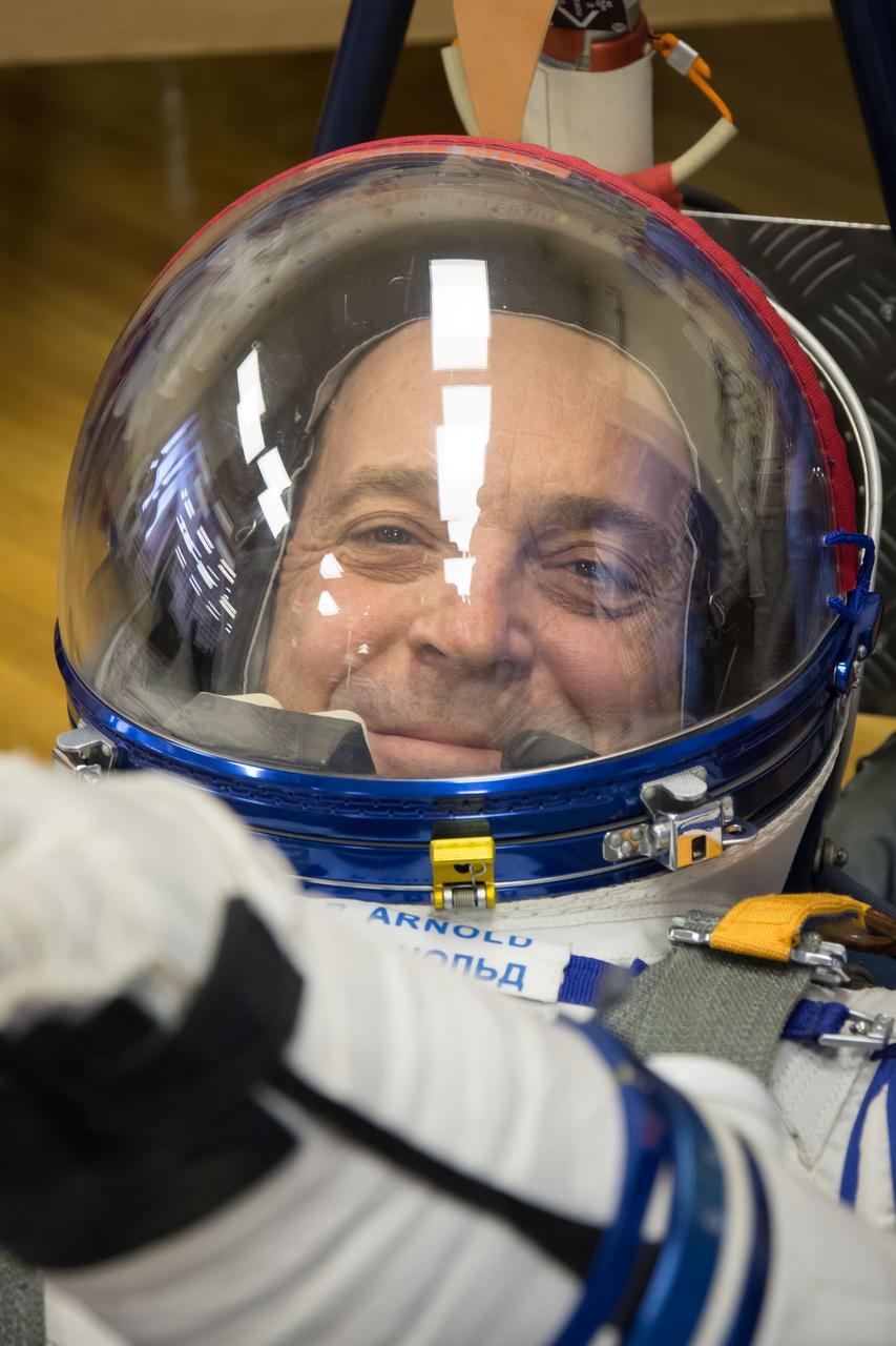 jsc2018e010871 - At the Baikonur Cosmodrome in Kazakhstan, Expedition 55 crewmember Ricky Arnold of NASA smiles as he undergoes a leak check March 5 in a Russian Sokol launch and entry suit as part of the crew’s first vehicle fit check activities. Arnold, Drew Feustel of NASA and Oleg Artemyev of Roscosmos will launch March 21 in the Soyuz MS-08 spacecraft from Baikonur for a five-month mission on the International Space Station...NASA/Victor Zelentsov.