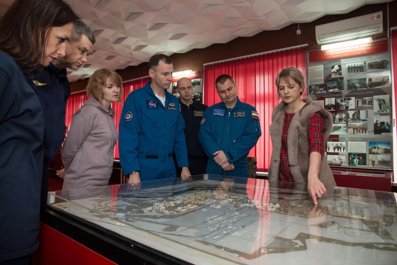In the city of Baikonur, Kazakhstan, Expedition 55 backup crewmembers Nick Hague of NASA (fourth from left) and Alexey Ovchinin of Roscosmos receive a briefing on the layout of the Baikonur Cosmodrome March 6 during a traditional tour of the city’s museu