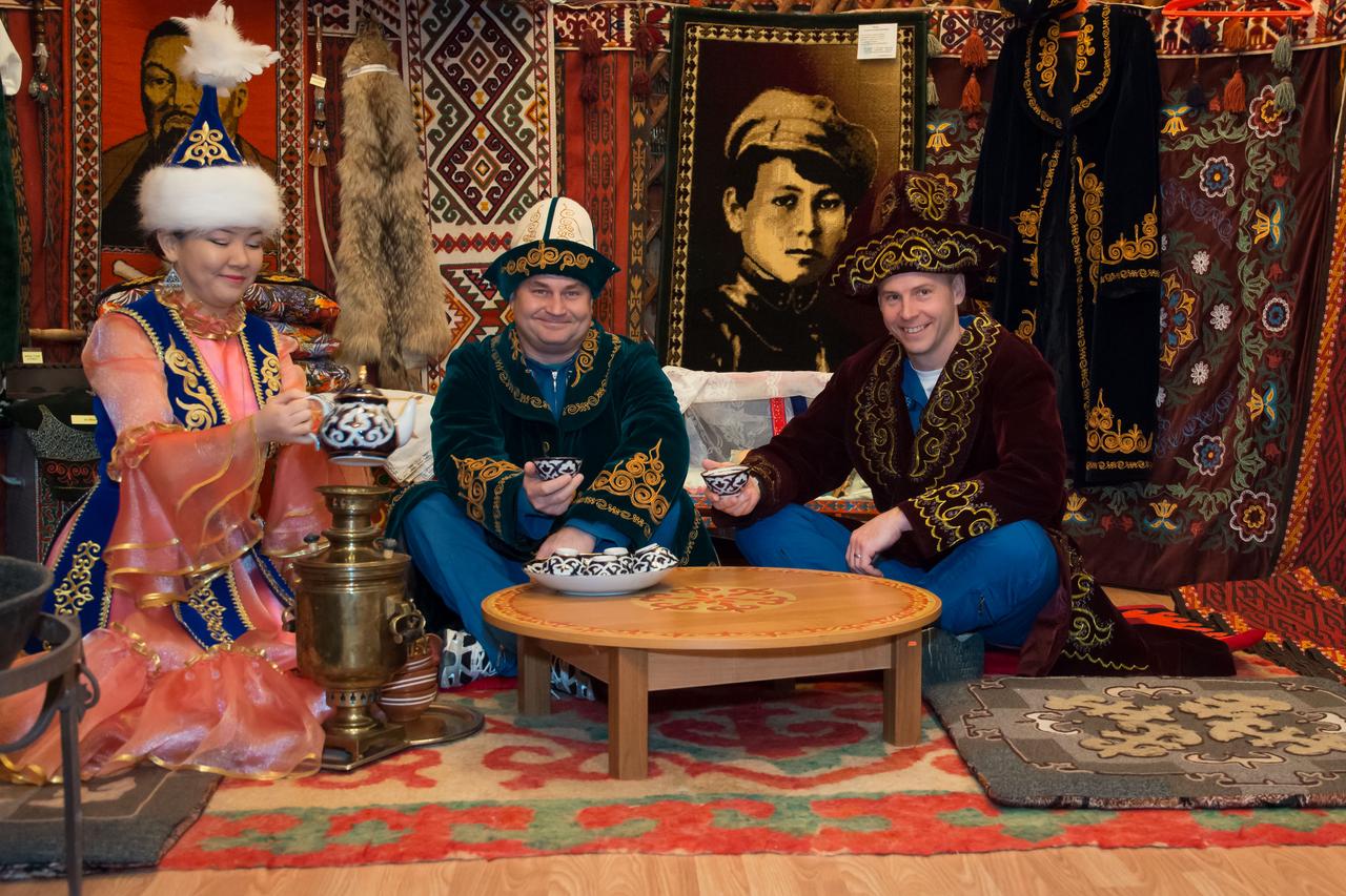 jsc2018e024051 -- In the city of Baikonur, Kazakhstan, Expedition 55 backup crewmembers Alexey Ovchinin of Roscosmos (center) and Nick Hague of NASA (right) pose for pictures March 6 in a “yurt”, a traditional Kazakh dwelling, during a pre-launch tour of the city’s museum. Prime crewmembers Drew Feustel and Ricky Arnold of NASA and Oleg Artemyev of Roscosmos will launch March 21 on the Soyuz MS-08 spacecraft from the Baikonur Cosmodrome for a five-month mission on the International Space Station. Credit: NASA/Victor Zelentsov