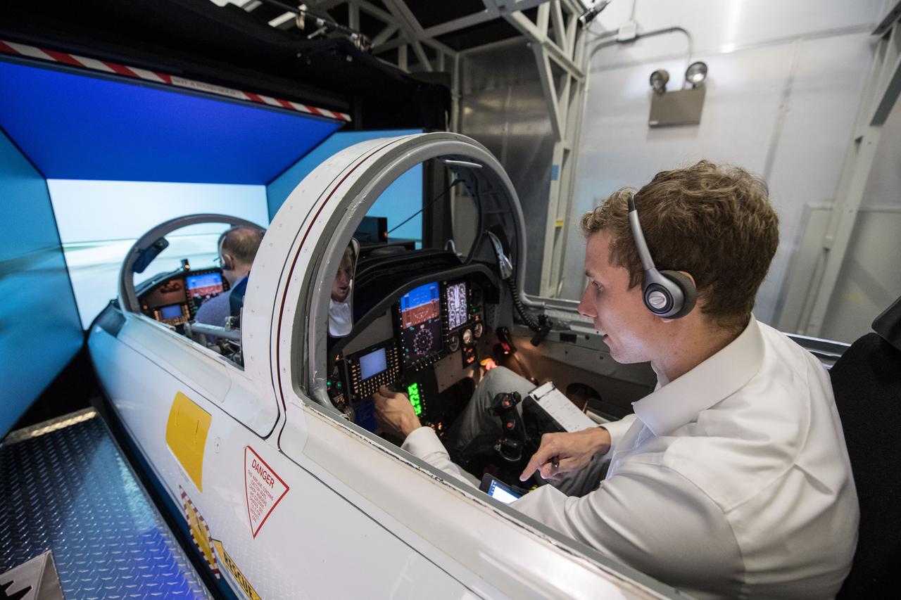 jsc2018e032531 (03-30-18) --- 2017 NASA astronaut candidate Warren Hoburg practices procedures alongside trainers during T-38 flight simulator training in Houston. Photo Credit: (NASA/James Blair)