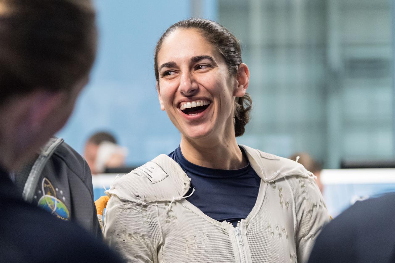jsc2018e035892 (April 11, 2018) --- NASA astronaut candidate Jasmin Moghbeli wears a Liquid Cooling and Ventilation Garment prior to underwater spacewalk training at NASA Johnson Space Center’s Neutral Buoyancy Laboratory. The cooling garment runs water throughout the suit to keep her cool during training. Photo Credit: (NASA/Josh Valcarcel)
