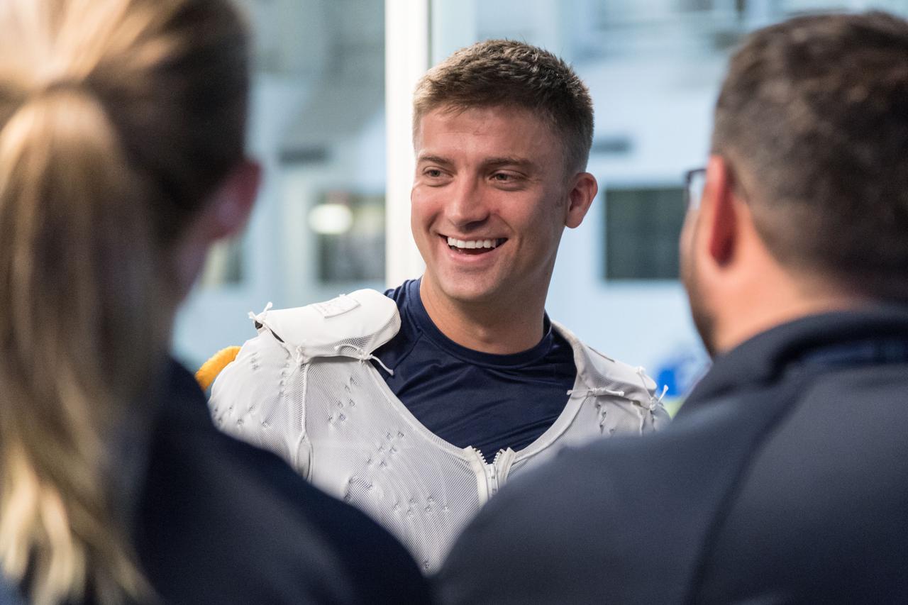 jsc2018e035893 (April 11, 2018) --- 2017 NASA astronaut candidate Matthew Dominick wears a Liquid Cooling and Ventilation Garment prior to underwater spacewalk training at NASA Johnson Space Center’s Neutral Buoyancy Laboratory. The cooling garment runs water throughout the suit to keep him cool during training. Photo Credit: (NASA/Josh Valcarcel)