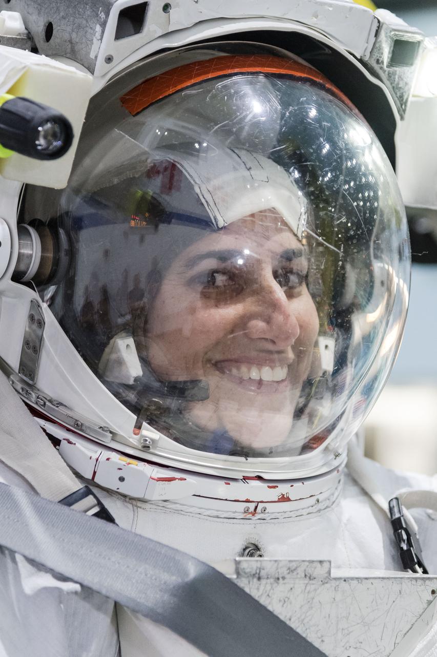 jsc2018e035922 (April 11, 2018) --- 2017 NASA astronaut candidate Jasmin Moghbeli wears a spacesuit prior to underwater spacewalk training at NASA Johnson Space Center’s Neutral Buoyancy Laboratory. Photo Credit: (NASA/Josh Valcarcel)