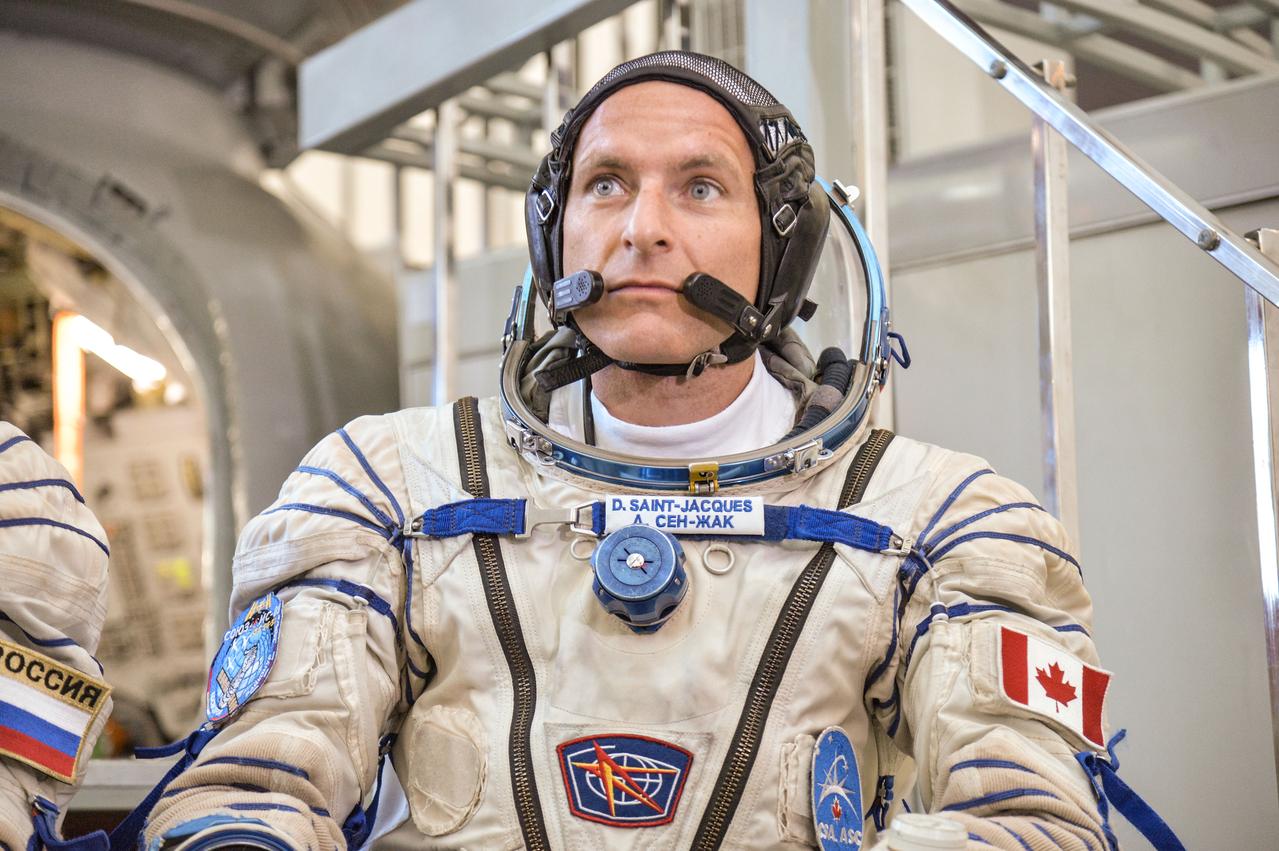 jsc2018e043408 (May 10, 2018) --- At the Gagarin Cosmonaut Training Center in Star City, Russia, Expedition 56 backup crew member David Saint-Jacques of the Canadian Space Agency listens to a reporter’s question May 10 following his final Soyuz qualification May 10. Saint-Jacques, Anne McClain of NASA and Oleg Kononenko of Roscosmos are the backups to the prime crew of Serena Aunon-Chancellor of NASA, Sergey Prokopyev of Roscosmos and Alexander Gerst of the European Space Agency, who will launch June 6 from the Baikonur Cosmodrome in Kazakhstan on the Soyuz MS-09 spacecraft for a six-month mission on the International Space Station...NASA/Elizabeth Weissinger.
