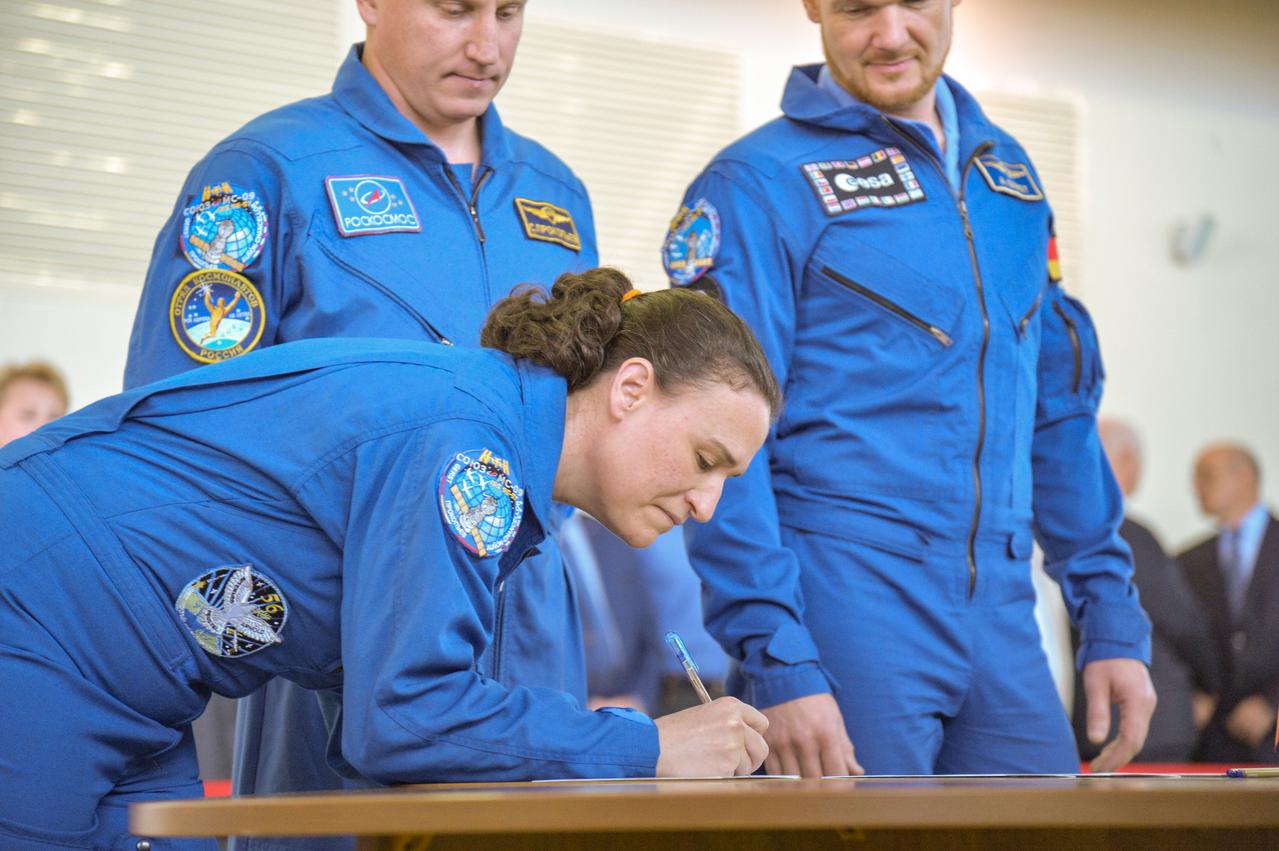 jsc2018e043412 (May 10, 2018) --- At the Gagarin Cosmonaut Training Center in Star City, Russia, Expedition 56 prime crew member Serena Aunon-Chancellor of NASA signs in for the first of two days of final Soyuz qualification exams May 10. Aunon-Chancellor, Sergey Prokopyev of Roscosmos (back, left) and Alexander Gerst of the European Space Agency (back, right) will launch June 6 from the Baikonur Cosmodrome in Kazakhstan on the Soyuz MS-09 spacecraft for a six-month mission on the International Space Station...NASA/Elizabeth Weissinger.