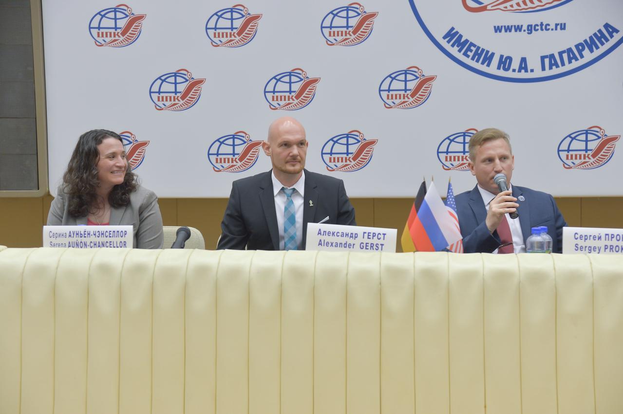 jsc2018e048495 - At the Gagarin Cosmonaut Training Center in Star City, Russia, Expedition 56 crewmember Sergey Prokopyev of Roscosmos (right) answers a reporter’s question May 14 during a crew news conference. Prokopyev, Serena Aunon-Chancellor of NASA (left) and Alexander Gerst of the European Space Agency (center) will launch June 6 from the Baikonur Cosmodrome in Kazakhstan on the Soyuz MS-09 spacecraft for a six month mission on the International Space Station...NASA/Elizabeth Weissinger.