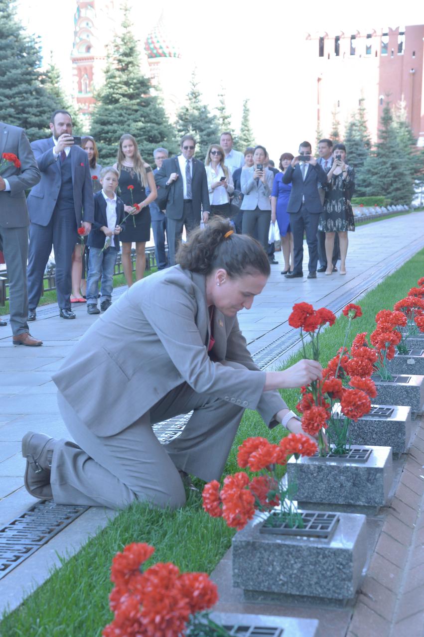 jsc2018e048503 - At the Kremlin Wall in Red Square in Moscow May 14, Expedition 56 crewmember Serena Aunon-Chancellor of NASA lays flowers where Russian space icons are interred as part of traditional pre-launch ceremonies. Aunon-Chancellor, Sergey Prokopyev of Roscosmos and Alexander Gerst of the European Space Agency will launch June 6 from the Baikonur Cosmodrome in Kazakhstan on the Soyuz MS-09 spacecraft for a six month mission on the International Space Station...NASA/Elizabeth Weissinger.