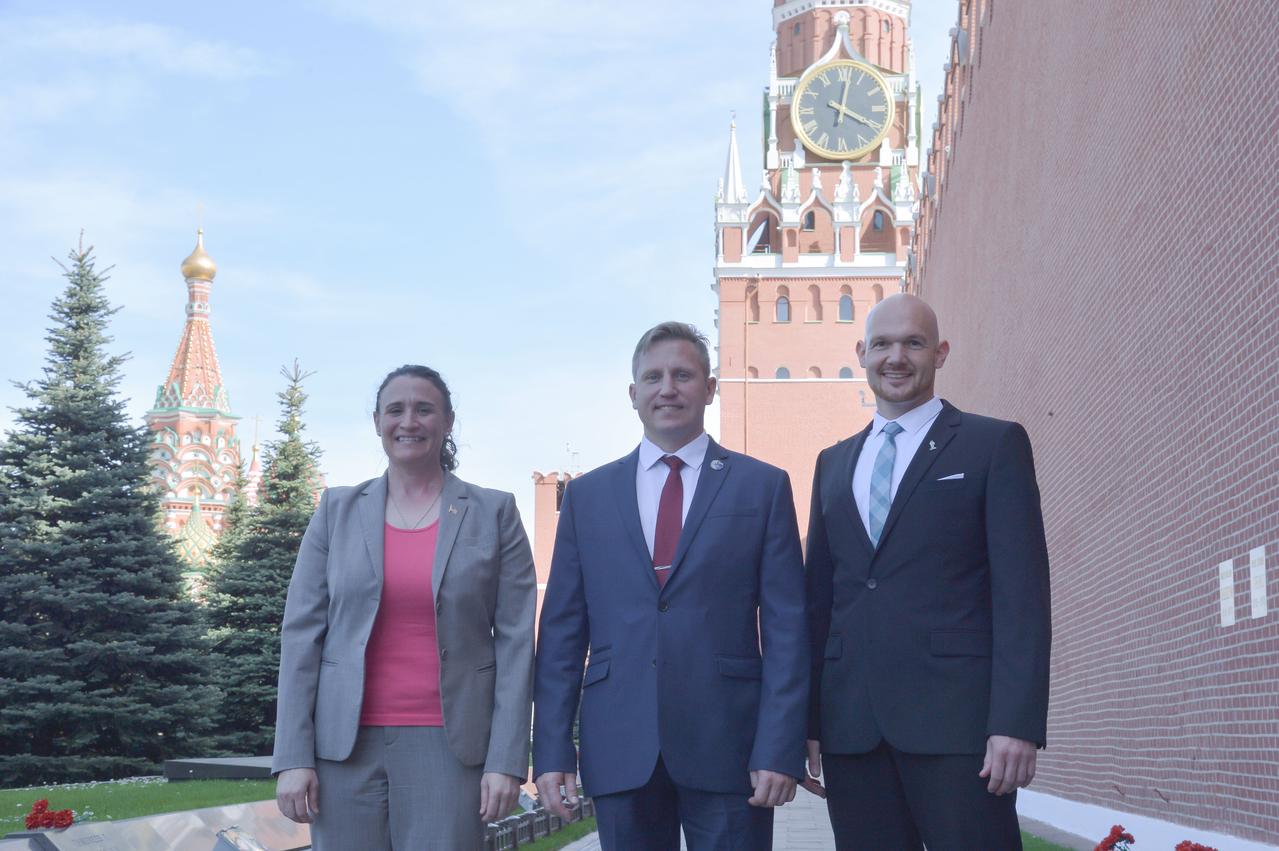 jsc2018e048505 - At the Kremlin Wall in Red Square in Moscow May 14, Expedition 56 prime crewmembers Serena Aunon-Chancellor of NASA (left), Sergey Prokopyev of Roscosmos (center) and Alexander Gerst of the European Space Agency (right) pose for pictures as part of traditional pre-launch activities. They will launch June 6 from the Baikonur Cosmodrome in Kazakhstan on the Soyuz MS-09 spacecraft for a six month mission on the International Space Station...NASA/Elizabeth Weissinger.