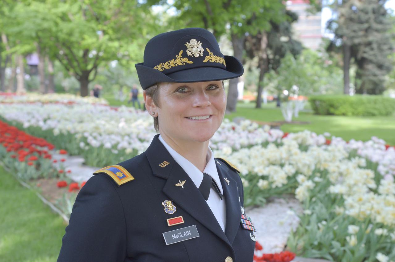 jsc2018e048512 - Expedition 56 backup crewmember Anne McClain of NASA poses for pictures in the Kremlin gardens in Moscow May 14 as part of traditional pre-launch activities. McClain is serving as a backup to the prime crew, Serena Aunon-Chancellor of NASA, Sergey Prokopyev of Roscosmos and Alexander Gerst of the European Space Agency, who will launch June 6 from the Baikonur Cosmodrome in Kazakhstan on the Soyuz MS-09 spacecraft for a six month mission on the International Space Station...NASA/Elizabeth Weissinger.