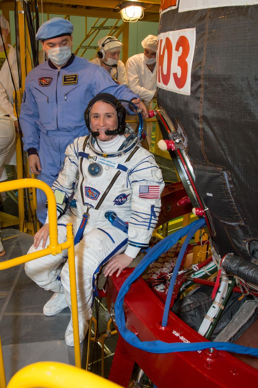 jsc2018e050003 - In the Integration Facility at the Baikonur Cosmodrome in Kazakhstan, Expedition 56 crewmember Serena Aunon-Chancellor of NASA poses for pictures May 20 as she prepares to board the Soyuz MS-09 spacecraft for the first fit check dress rehearsal activities. Aunon-Chancellor, Sergey Prokopyev of Roscosmos and Alexander Gerst of the European Space Agency will launch June 6 on the Soyuz MS-09 spacecraft from Baikonur for a six-month mission on the International Space Station...NASA/Victor Zelentsov.