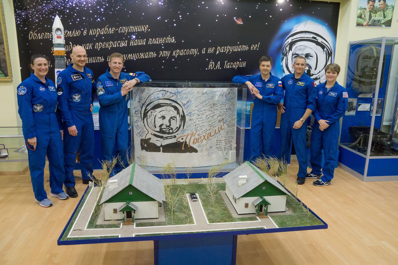 jsc2018e051931 - In the Korolev Museum at the Baikonur Cosmodrome in Kazakhstan, the Expedition 56 prime and backup crews pose for pictures May 31 flanking a portrait of Yuri Gagarin, the first human to fly in space. From left to right are the prime crewmembers, Serena Aunon-Chancellor of NASA, Alexander Gerst of the European Space Agency and Sergey Prokopyev of Roscosmos and the backup crew, Oleg Kononenko of Roscosmos, David Saint-Jacques of the Canadian Space Agency and Anne McClain of NASA. Aunon-Chancellor, Prokopyev and Gerst will launch June 6 in the Soyuz MS-09 spacecraft for a six-month mission on the International Space Station. ..NASA/Victor Zelentsov.