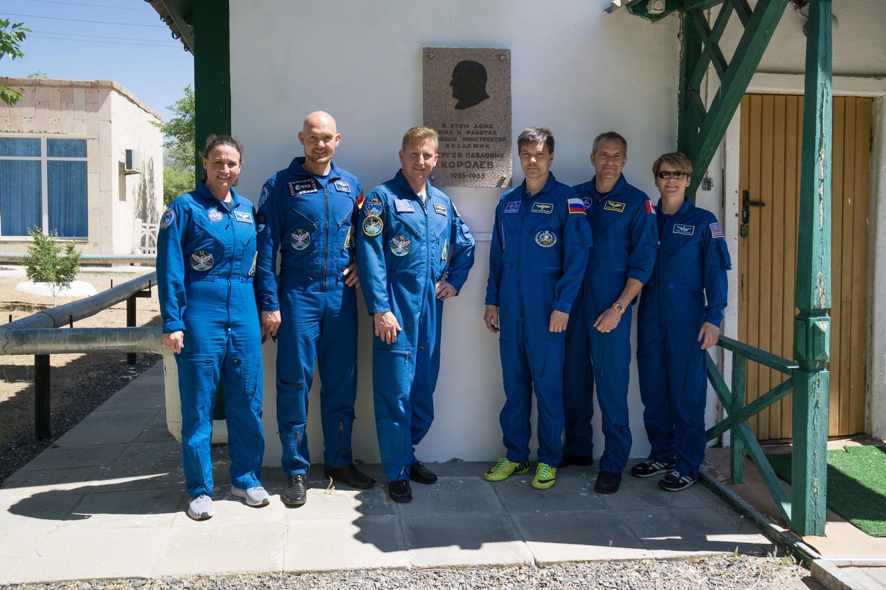 jsc2018e051937 - The Expedition 56 prime and backup crewmembers pose for pictures May 31 outside the cottage where Sergei Korolev, the iconic Russian space designer slept on the night before Yuri Gagarin launched on April 12, 1961 to become the first human to fly in space. Gagarin slept in an adjacent cottage to Korolev’s cottage the night before his launch. From left to right are the prime crewmembers, Serena Aunon-Chancellor of NASA, Alexander Gerst of the European Space Agency and Sergey Prokopyev of Roscosmos and their backups, Oleg Kononenko of Roscosmos, David Saint-Jacques of the Canadian Space Agency and Anne McClain of NASA. Aunon-Chancellor, Prokopyev and Gerst will launch June 6 in the Soyuz MS-09 spacecraft for a six-month mission on the International Space Station. ..NASA/Victor Zelentsov.