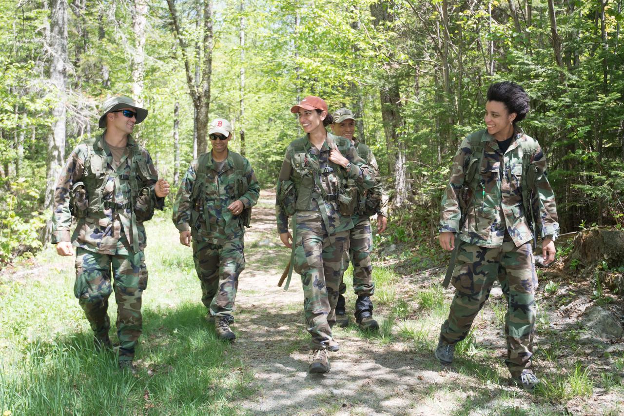 jsc2018e052141 (May 30, 2018) --- (From left) 2017 NASA astronaut candidates Matthew Dominick, Raja Chari, Jasmin Moghbeli, Frank Rubio, and Jessica Watkins take time to bond on their hike during wilderness survival training at the U.S. Navy’s Survival, Evasion, Resistance, and Escape School in Brunswick, Maine. Photo Credit: (NASA/Josh Valcarcel)