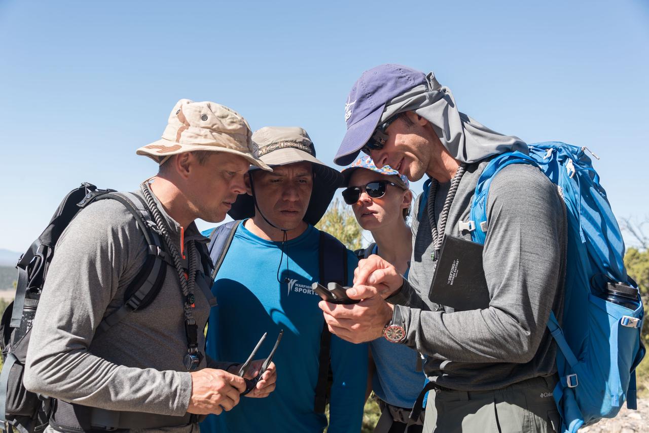 jsc2018e060169 (06/19/2018) --- (L-R) 2017 NASA astronaut candidates Bob Hines, Frank Rubio, Zena Cardman follow the guidance of Canadian Space Agency astronaut candidate Joshua Kutryk during earth and planetary science training in Rio Grande del Norte National Monument Upper Gorge Area near Questa, N.M. Photo Credit: (NASA/Norah Moran)
