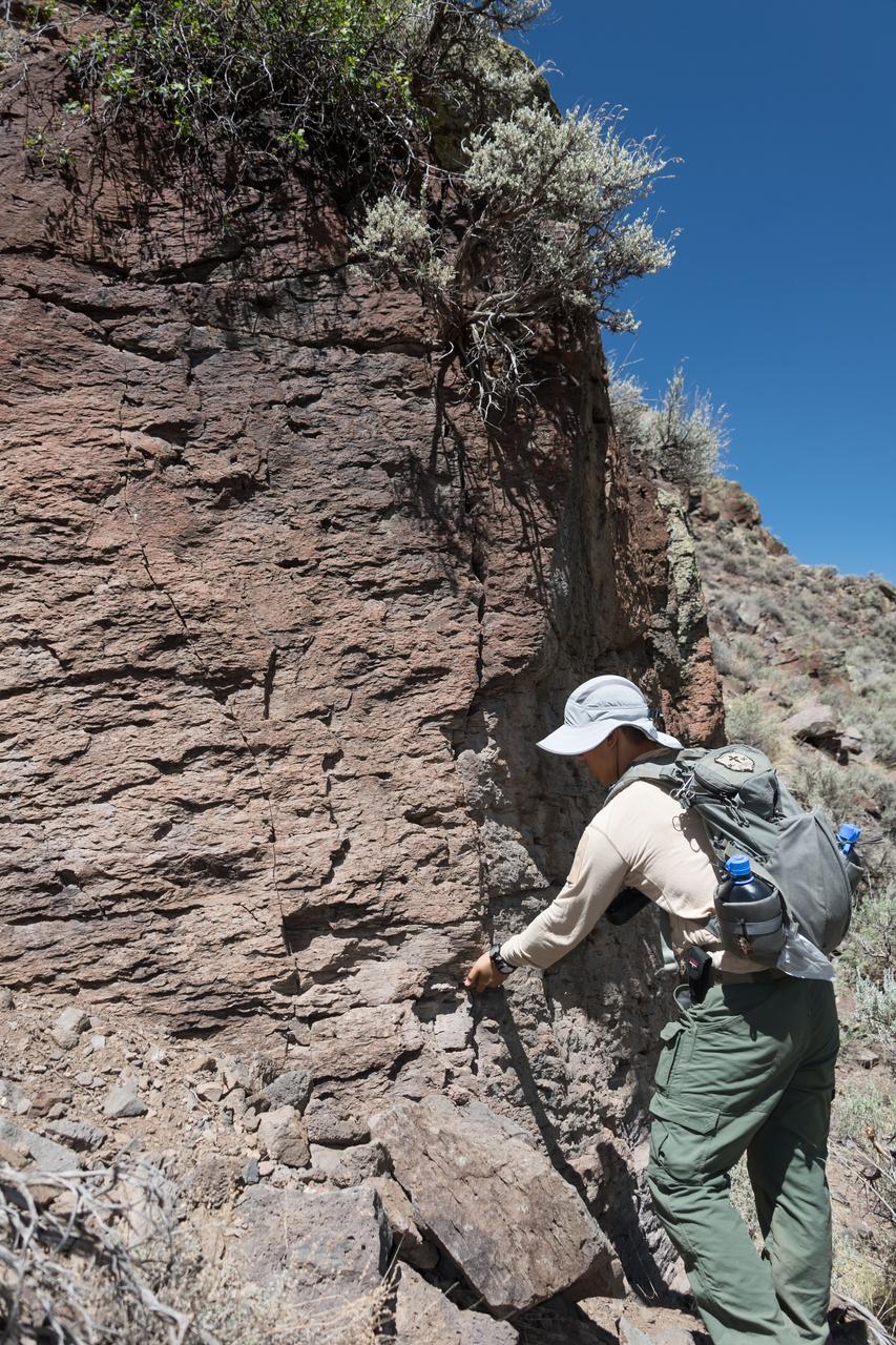 jsc2018e060231 (06/19/2018) --- 2017 NASA astronaut candidate Jonny Kim during earth and planetary science training in Rio Grande del Norte National Monument Upper Gorge Area near Questa, N.M. Photo Credit: (NASA/Norah Moran)