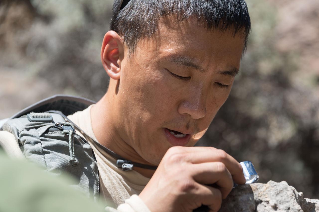 jsc2018e060239 (06/19/2018) --- 2017 NASA astronaut candidate Jonny Kim during earth and planetary science training in Rio Grande del Norte National Monument Upper Gorge Area near Questa, N.M. Photo Credit: (NASA/Norah Moran)