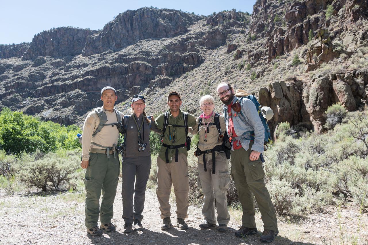 jsc2018e060253 (06/19/2018) --- (From left) 2017 NASA astronaut candidates Jonny Kim, Loral O’Hara, and Raja Chari with their guides during earth and planetary science training in Rio Grande del Norte National Monument Upper Gorge Area near Questa, N.M. Photo Credit: (NASA/Norah Moran)