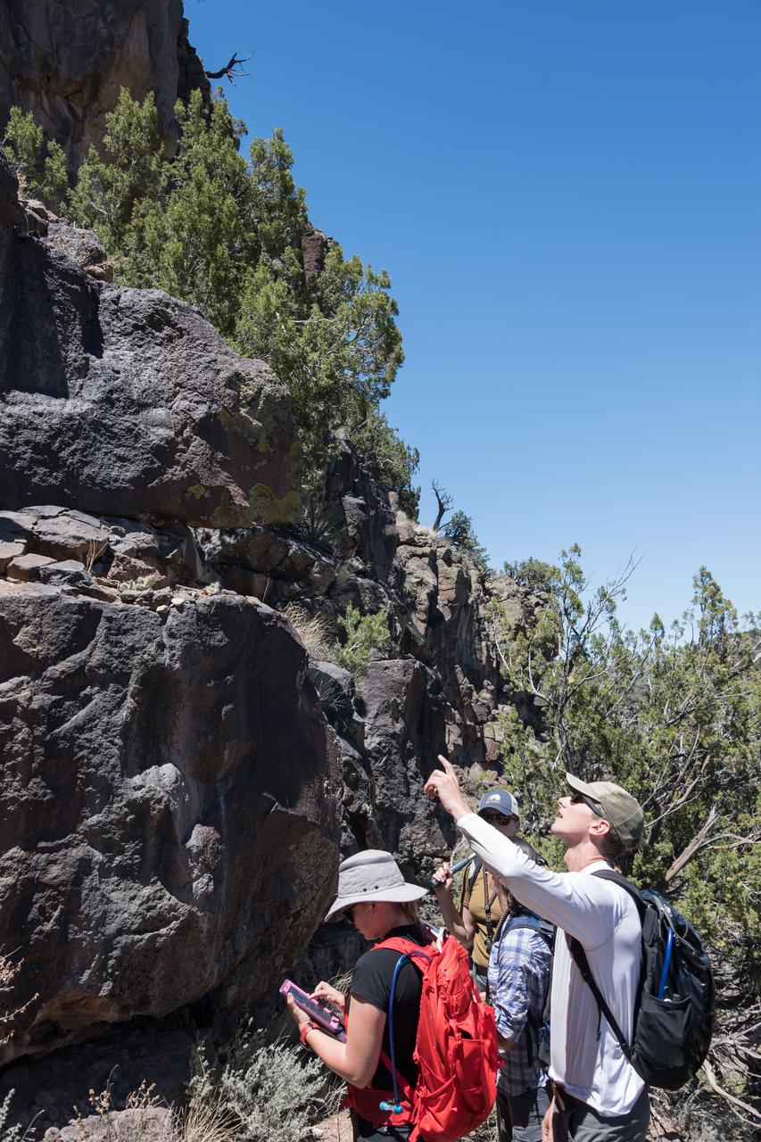 jsc2018e060299 (06/20/2018) --- 2017 NASA astronaut candidates taking notes during earth and planetary science training in Rio Grande del Norte National Monument Upper Gorge Area near Questa, N.M. Photo Credit: (NASA/Norah Moran)