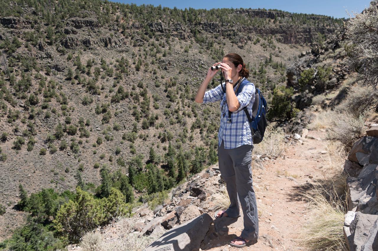 jsc2018e060316 (06/20/2018) --- 2017 NASA astronaut candidate Jasmin Moghbeli during earth and planetary science training in Rio Grande del Norte National Monument Upper Gorge Area near Questa, N.M. Photo Credit: (NASA/Norah Moran)
