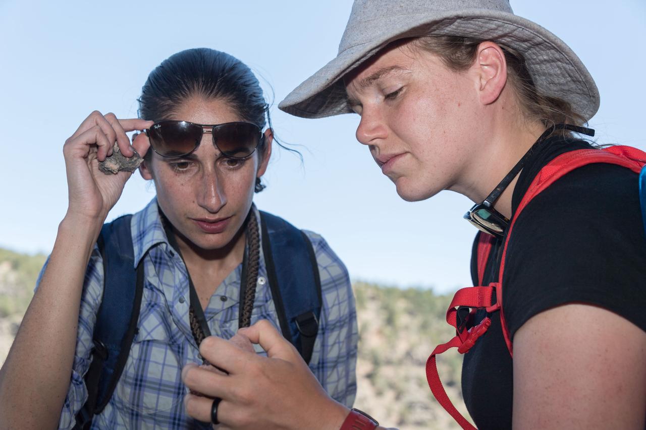 jsc2018e060323 (06/20/2018) --- 2017 NASA astronaut candidate Jasmin Moghbeli and Canadian Space Agency astronaut candidate Jennifer Sidey-Gibbons during earth and planetary science training in Rio Grande del Norte National Monument Upper Gorge Area near Questa, N.M. Photo Credit: (NASA/Norah Moran)