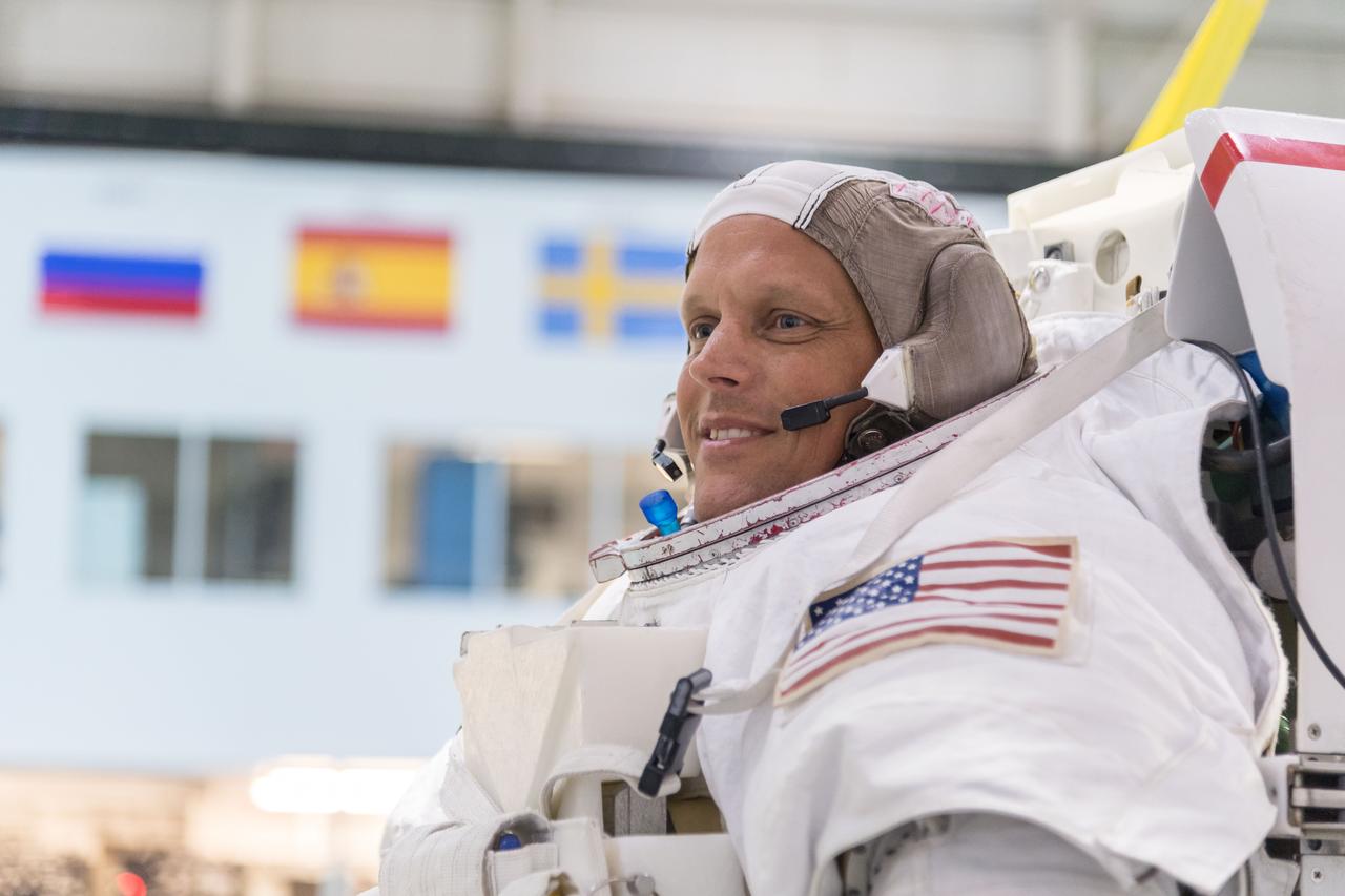 jsc2018e064835 (07/18/2018) --- 2017 NASA astronaut candidate Bob Hines in a spacesuit prior to underwater spacewalk training at NASA Johnson Space Center’s Neutral Buoyancy Laboratory in Houston. Photo Credit: (NASA/Norah Moran)
