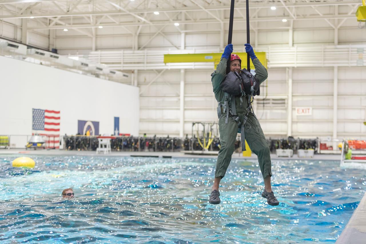 NASA commercial crew astronaut Josh Cassada practices water survival techniques at the Neutral Bouyancy Laboratory. Cassada is assigned to the second crewed flight to the International Space Station of Boeing’s CST-100 Starliner.