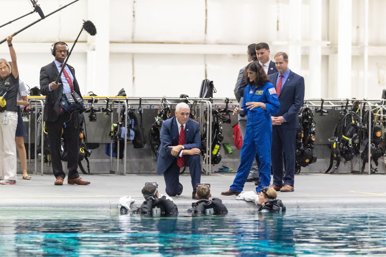 jsc2018e076664 (Aug. 23, 2018) --- Vice President Mike Pence and NASA Administrator Jim Bridenstine visit the Sonny Carter Training Center (Neutral Buoyancy Lab) at NASA’s Johnson Space Center on Aug. 23, 2018. Pence and Bridenstine spoke with astronaut Suni Williams, and astronaut candidates Jonny Kim, Warren "Woody" Hoburg and Loral O’Hara poolside. While in the Test Control Room, they joined Flight Operations Director Brian Kelly and talked with astronauts Victor Glover and Nicole Mann as they practiced spacewalk tasks underwater.