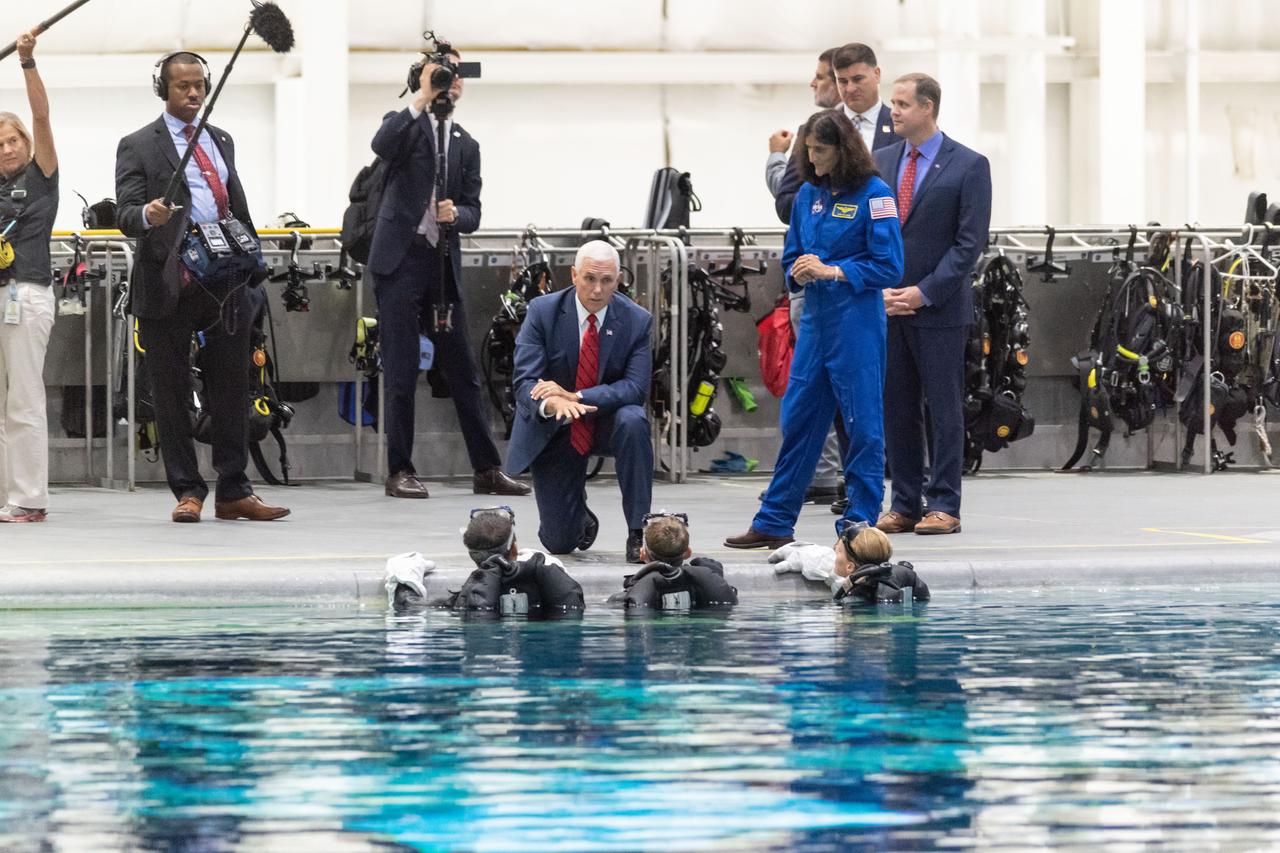 jsc2018e076665 (Aug.  23, 2018) --- Vice President Mike Pence and NASA Administrator Jim Bridenstine visit the Sonny Carter Training Center (Neutral Buoyancy Lab) at NASA’s Johnson Space Center on Aug. 23, 2018. Pence and Bridenstine spoke with astronaut Suni Williams, and astronaut candidates Jonny Kim, Warren "Woody" Hoburg and Loral O’Hara poolside. While in the Test Control Room, they joined Flight Operations Director Brian Kelly and talked with astronauts Victor Glover and Nicole Mann as they practiced spacewalk tasks underwater.