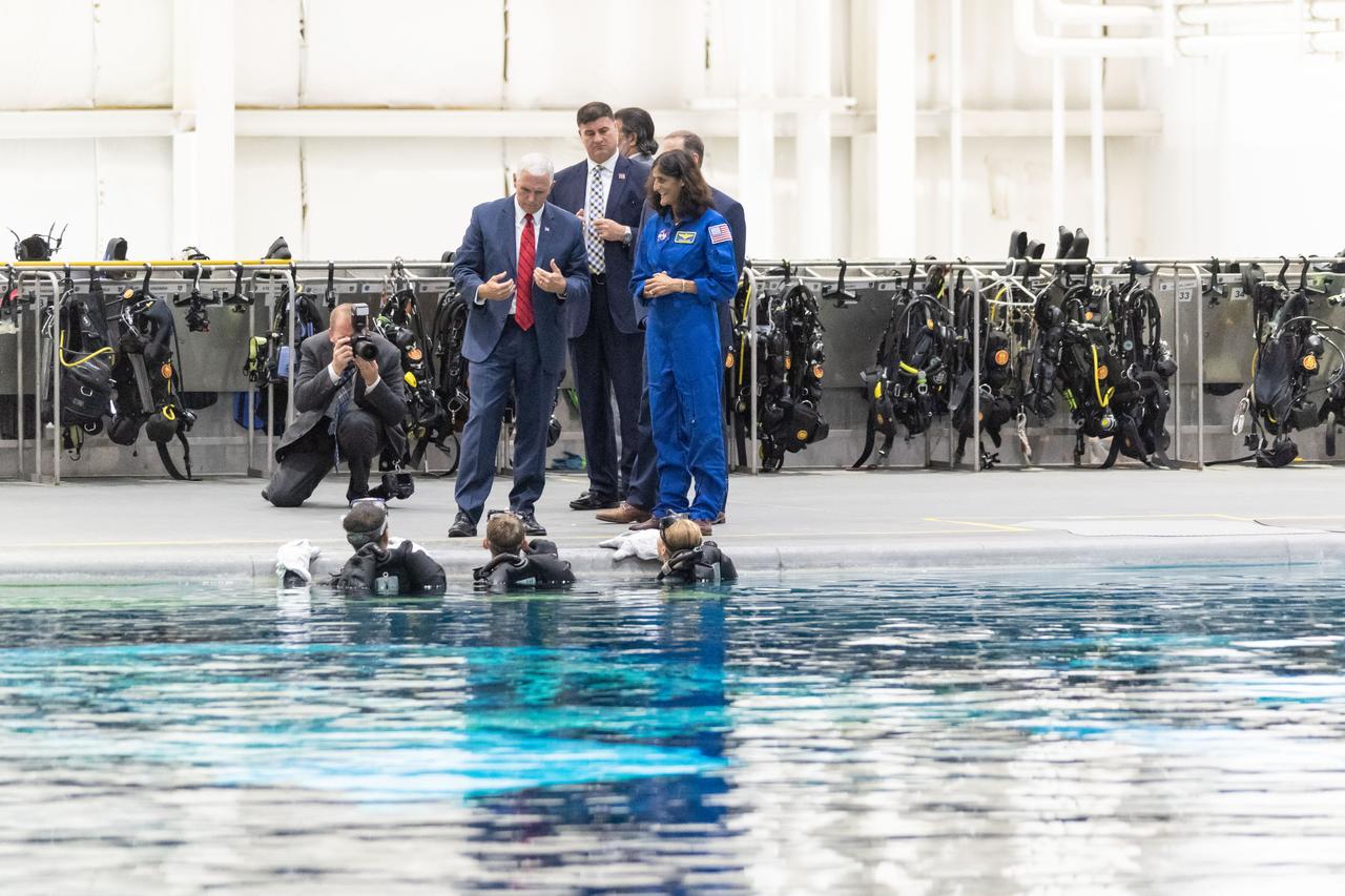 jsc2018e076666 (Aug. 23, 2018) --- Vice President Mike Pence and NASA Administrator Jim Bridenstine visit the Sonny Carter Training Center (Neutral Buoyancy Lab) at NASA’s Johnson Space Center on Aug. 23, 2018. Pence and Bridenstine spoke with astronaut Suni Williams, and astronaut candidates Jonny Kim, Warren "Woody" Hoburg and Loral O’Hara poolside. While in the Test Control Room, they joined Flight Operations Director Brian Kelly and talked with astronauts Victor Glover and Nicole Mann as they practiced spacewalk tasks underwater.