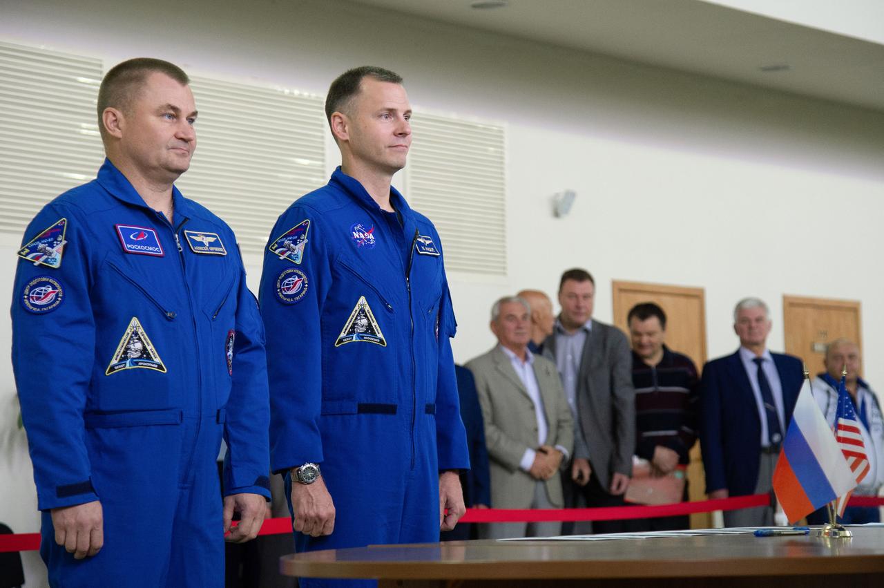 jsc2018e081041 (Sept. 12, 2018) --- At the Gagarin Cosmonaut Training Center in Star City, Russia, Expedition 57 crewmembers Alexey Ovchinin of Roscosmos (left) and Nick Hague of NASA (right) report to officials Sept. 13 for the first day of their Soyuz qualification exams. They are scheduled to launch Oct. 11 from the Baikonur Cosmodrome in Kazakhstan on the Soyuz MS-10 spacecraft for a six month mission on the International Space Station...NASA/Elizabeth Weissinger.