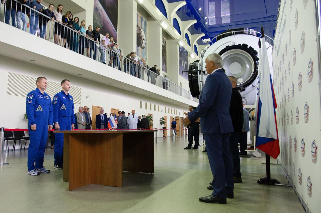 jsc2018e081043 (Sept. 12, 2018) --- At the Gagarin Cosmonaut Training Center in Star City, Russia, Expedition 57 crewmembers Alexey Ovchinin of Roscosmos and Nick Hague of NASA report to officials Sept. 13 for the first day of their Soyuz qualification exams. They are scheduled to launch Oct. 11 from the Baikonur Cosmodrome in Kazakhstan on the Soyuz MS-10 spacecraft for a six month mission on the International Space Station...NASA/Elizabeth Weissinger.