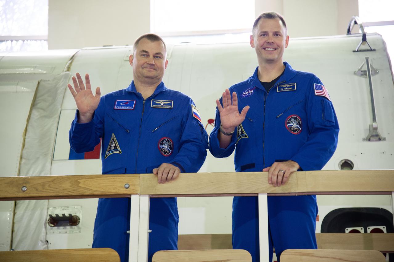 jsc2018e081044 (Sept. 12, 2018) --- At the Gagarin Cosmonaut Training Center in Star City, Russia, Expedition 57 crewmembers Alexey Ovchinin of Roscosmos and Nick Hague of NASA wave to reporters Sept. 13 during the first day of their Soyuz qualification exams. They are scheduled to launch Oct. 11 from the Baikonur Cosmodrome in Kazakhstan on the Soyuz MS-10 spacecraft for a six month mission on the International Space Station...NASA/Elizabeth Weissinger.
