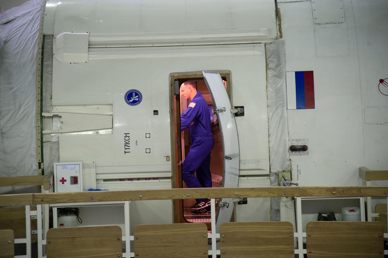 jsc2018e081046 (Sept. 12, 2018) --- At the Gagarin Cosmonaut Training Center in Star City, Russia, Expedition 57 crewmember Nick Hague of NASA is seen through the hatchway of a Russian module trainer during the first day of qualification exams Sept. 13. Hague and Alexey Ovchinin of Roscosmos are scheduled to launch Oct. 11 from the Baikonur Cosmodrome in Kazakhstan on the Soyuz MS-10 spacecraft for a six month mission on the International Space Station...NASA/Elizabeth Weissinger.