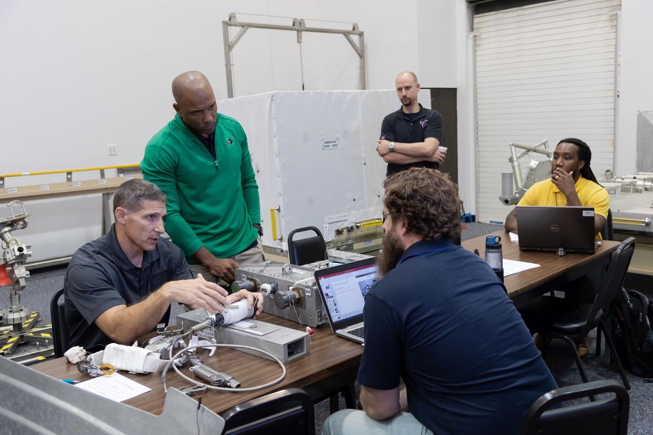 NASA commercial crew astronauts Mike Hopkins and Victor Glover get training on some of the tools they could use during spacewalks at the International Space Station. Hopkins and Glover are both assigned to the SpaceX Crew Dragon’s second crewed flight.