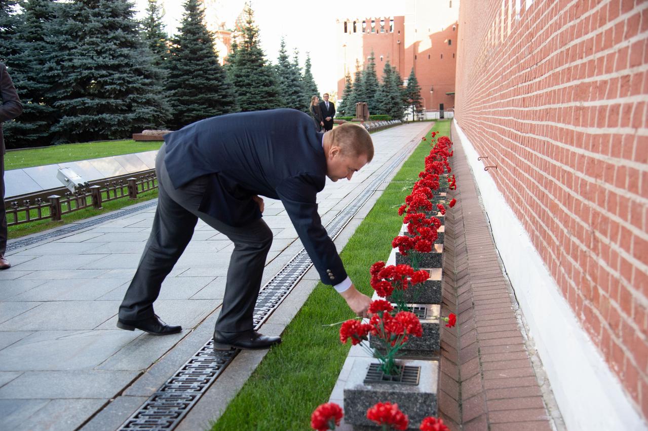 At Red Square in Moscow, Expedition 57 crewmember Alexey Ovchinin of Roscosmos lays flowers at the Kremlin Wall where Russian space icons are interred Sept. 17 as part of traditional ceremonies. Ovchinin and Nick Hague of NASA will launch Oct. 11 from the Baikonur Cosmodrome in Kazakhstan on the Soyuz MS-10 spacecraft for a six-month mission on the International Space Station...NASA/Elizabeth Weissinger.