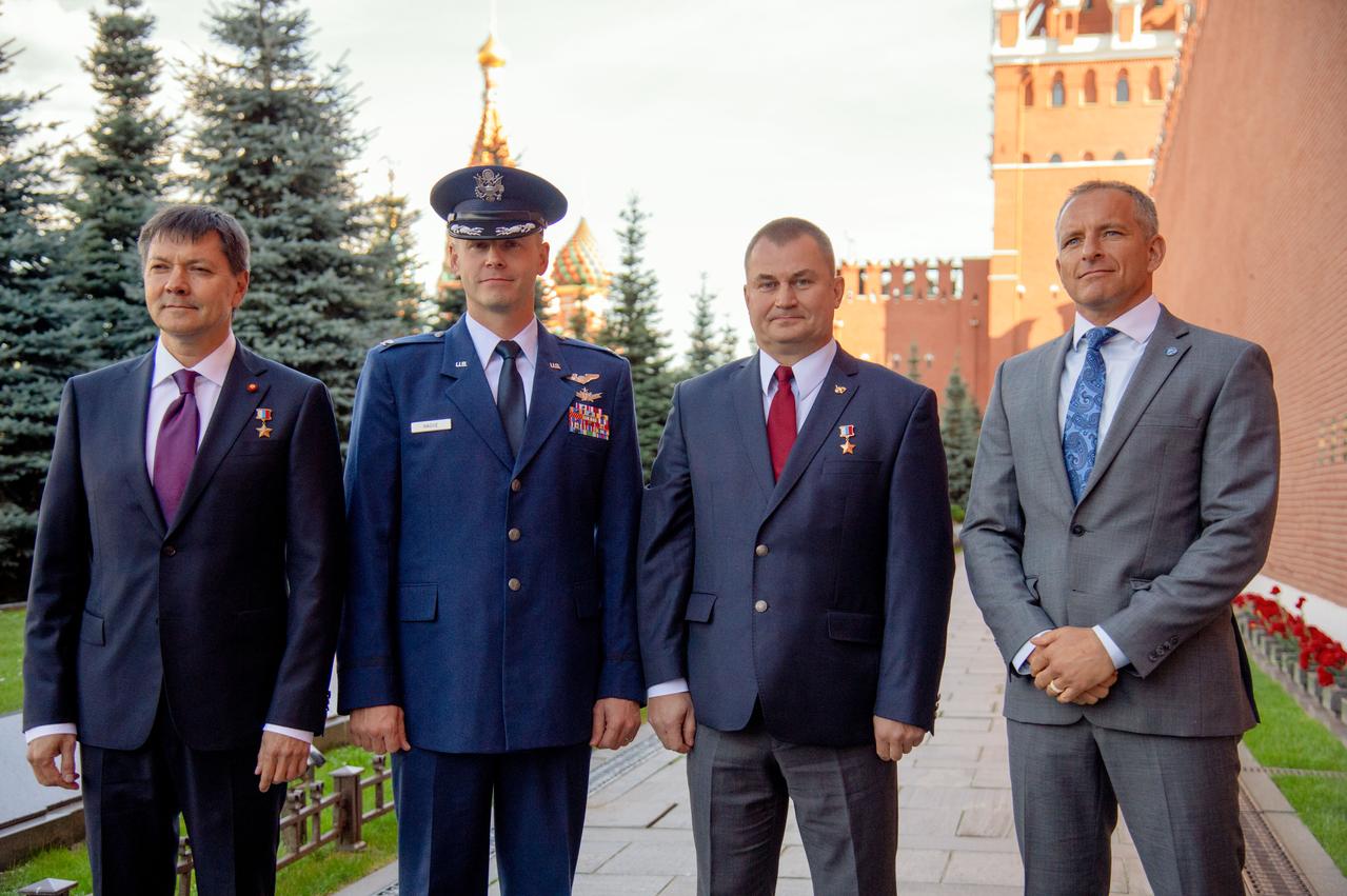 At the Kremlin Wall in Red Square in Moscow, the Expedition 57 prime and backup crewmembers pose for pictures Sept. 17 during traditional ceremonies. From left to right are backup crewmember Oleg Kononenko of Roscosmos,, prime crewmembers Nick Hague of NASA and Alexey Ovchinin of Roscosmos and backup crewmember David Saint-Jacques of the Canadian Space Agency. Hague and Ovchinin will launch Oct. 11 from the Baikonur Cosmodrome in Kazakhstan on the Soyuz MS-10 spacecraft for a six-month mission on the International Space Station...NASA/Elizabeth Weissinger.