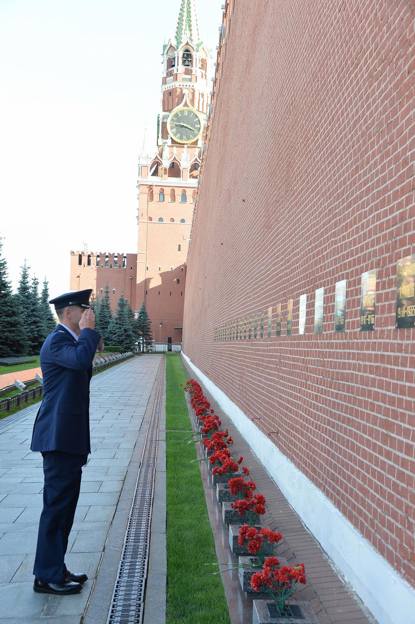 At Red Square in Moscow, Expedition 57 crewmember Nick Hague of NASA salutes after laying flowers at the Kremlin Wall where Russian space icons are interred as part of traditional ceremonies Sept. 17. Hague and Alexey Ovchinin of Roscosmos will launch Oct. 11 from the Baikonur Cosmodrome in Kazakhstan on the Soyuz MS-10 spacecraft for a six-month mission on the International Space Station...NASA/Sarah Volkman.